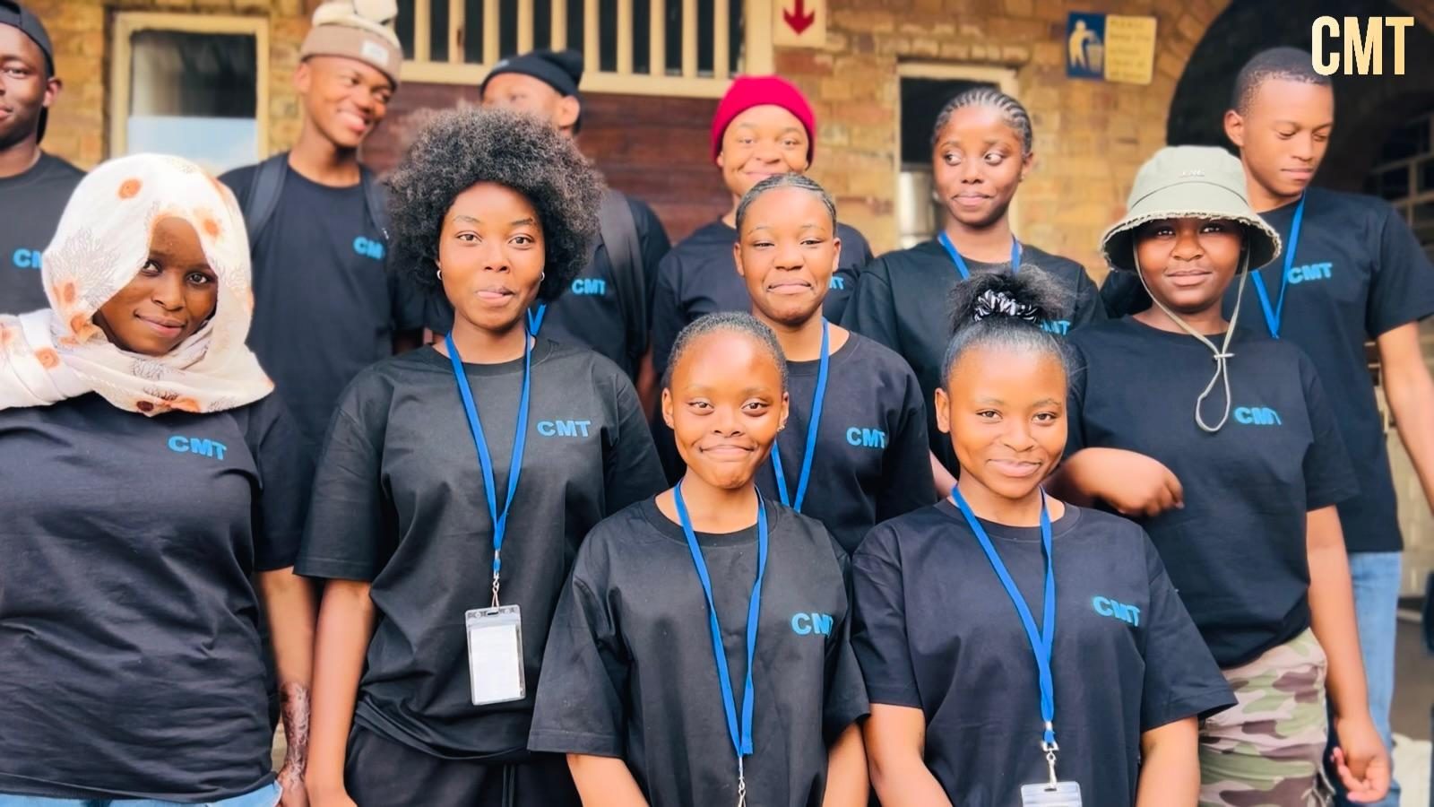 Group of CMT learners in branded shirts
