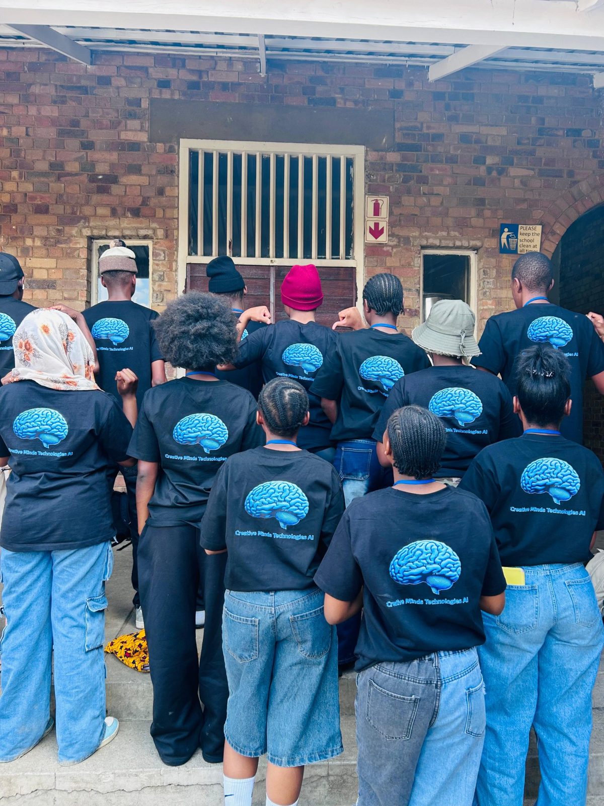 CMT learners wearing Creative Minds Technologies AI shirts